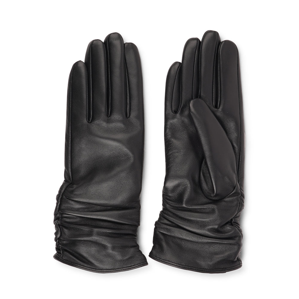 The Asti gloves are crafted from supple leather and lined with luxurious cashmere, offering both elegance and warmth.
Designed with a feminine touch, these gloves provide a sleek and sophisticated look while ensuring superior comfort during colder days. Perfect for adding a touch of refinement to any winter outfit.