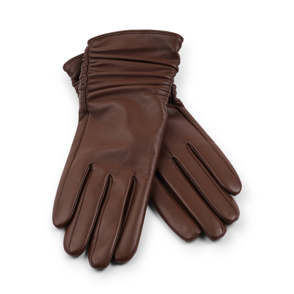 Lovelies Studio - Denmark - The Asti gloves are crafted from supple leather and lined with luxurious cashmere, offering both elegance and warmth.
Designed with a feminine touch, these gloves provide a sleek and sophisticated look while ensuring superior comfort during colder days. Perfect for adding a touch of refinement to any winter outfit.