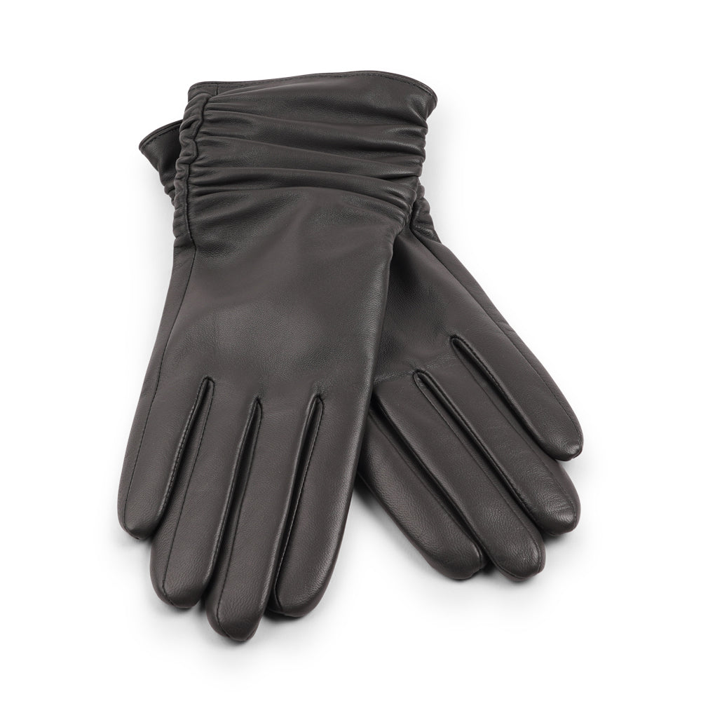 Lovelies Studio - Denmark - The Asti gloves are crafted from supple leather and lined with luxurious cashmere, offering both elegance and warmth.
Designed with a feminine touch, these gloves provide a sleek and sophisticated look while ensuring superior comfort during colder days. Perfect for adding a touch of refinement to any winter outfit.