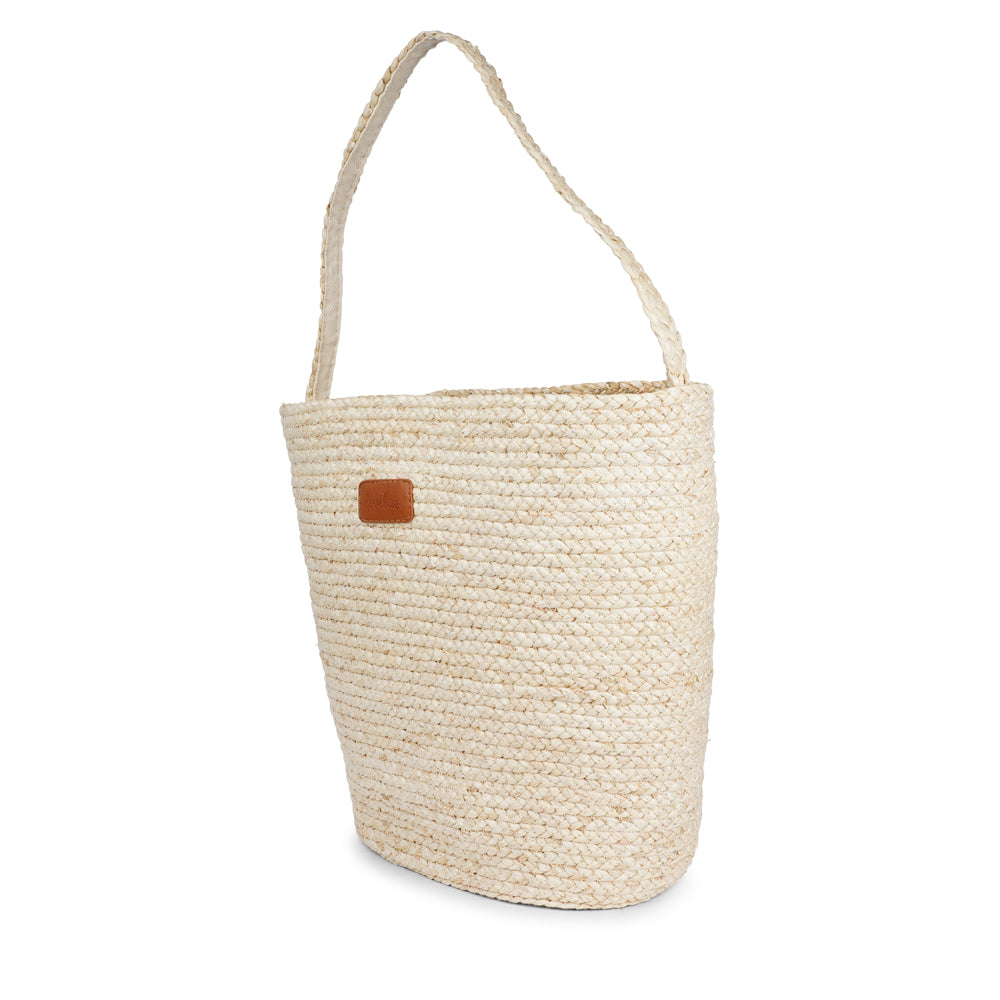 Lovelies Studio - Denmark - Handmade with care, the Cerbus Maize Bag is your perfect companion for a trip to the market or a sunny day at the beach. Made of beautifully braided maize, it features a soft cotton lining and a small inner pocket—perfect for keeping your phone or essentials close at hand. Spacious, lightweight, and full of natural charm – it’s where function meets effortless style.