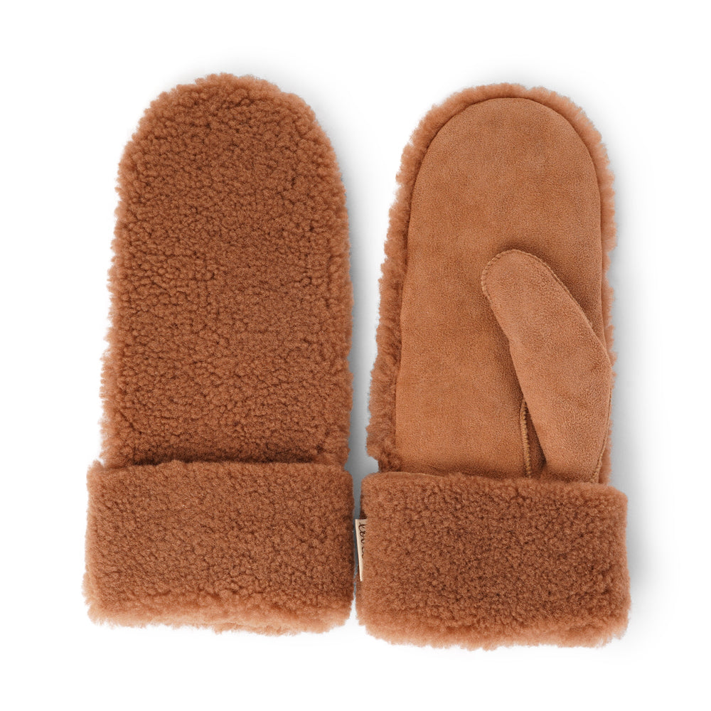 The cozy Colon mittens are made of 100% Australian double faced shearling.  The palm is soft sheep skin and the beautiful upper, cuff and the lining are curly sheep fur. The thumb is made with only one side sawing for the best comfort and style.  Our Colon mittens are extra long which means that you can fold and wear them in 4 different ways.