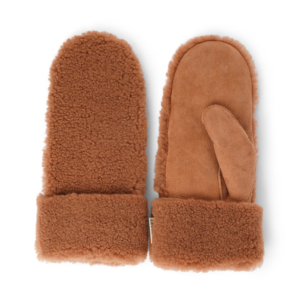 The cozy Colon mittens are made of 100% Australian double faced shearling. The palm is soft sheep skin and the beautiful upper, cuff and the lining are curly sheep fur. The thumb is made with only one side sawing for the best comfort and style. Our Colon mittens are extra long which means that you can fold and wear them in 4 different ways.