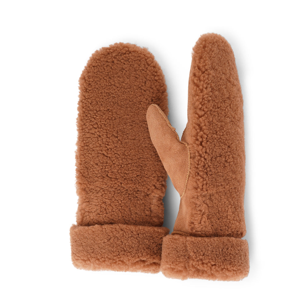 The cozy Colon mittens are made of 100% Australian double faced shearling. The palm is soft sheep skin and the beautiful upper, cuff and the lining are curly sheep fur. The thumb is made with only one side sawing for the best comfort and style. Our Colon mittens are extra long which means that you can fold and wear them in 4 different ways.