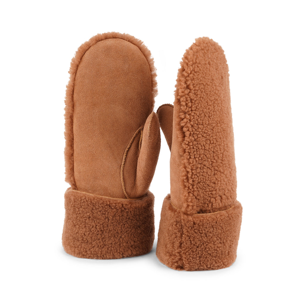The cozy Colon mittens are made of 100% Australian double faced shearling.  The palm is soft sheep skin and the beautiful upper, cuff and the lining are curly sheep fur. The thumb is made with only one side sawing for the best comfort and style.  Our Colon mittens are extra long which means that you can fold and wear them in 4 different ways.