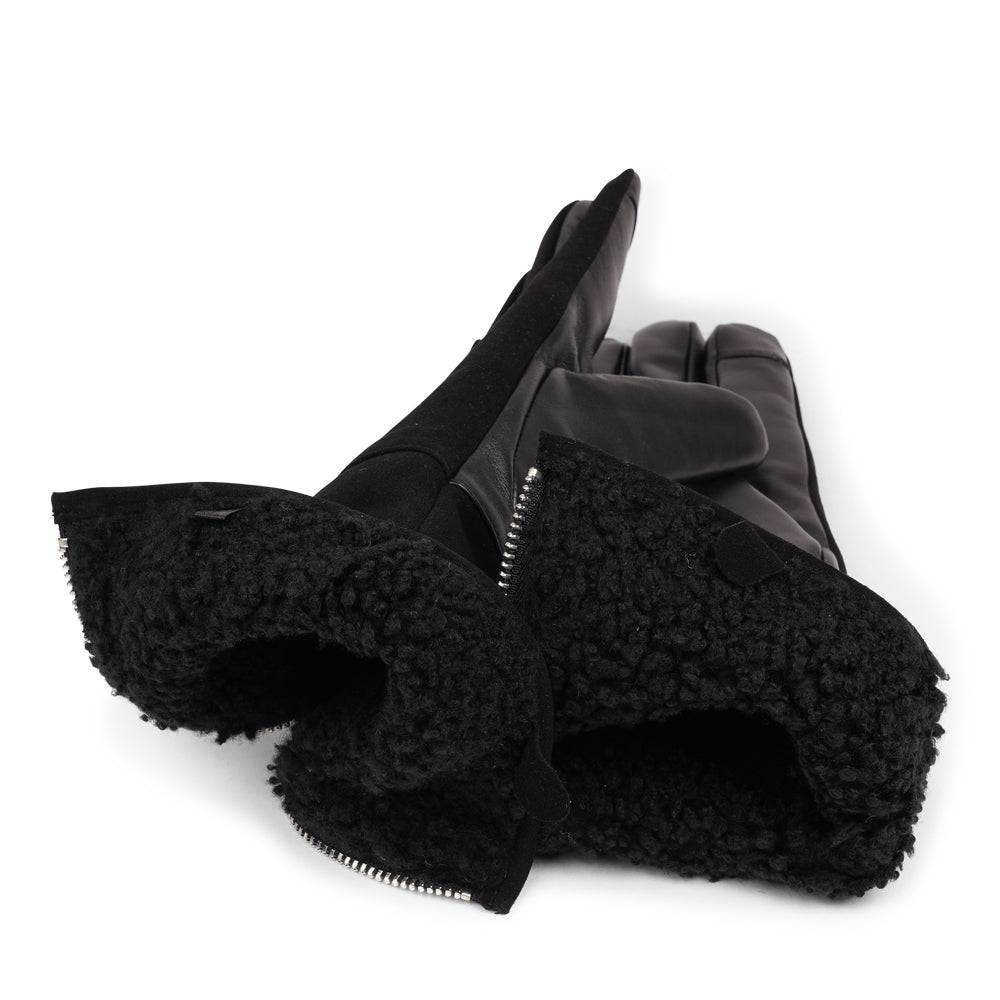 Lovelies Studio - The Cremona gloves combine elegance and warmth, crafted from soft leather with a chic zip detail for a modern touch. Lined with luxurious shearling, these gloves offer superior comfort and insulation.
Their feminine design and refined style make Cremona the perfect accessory for staying stylish in colder weather.