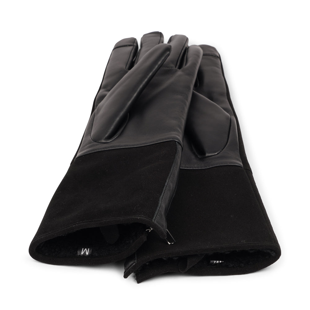 Lovelies Studio - The Cremona gloves combine elegance and warmth, crafted from soft leather with a chic zip detail for a modern touch. Lined with luxurious shearling, these gloves offer superior comfort and insulation.
Their feminine design and refined style make Cremona the perfect accessory for staying stylish in colder weather.