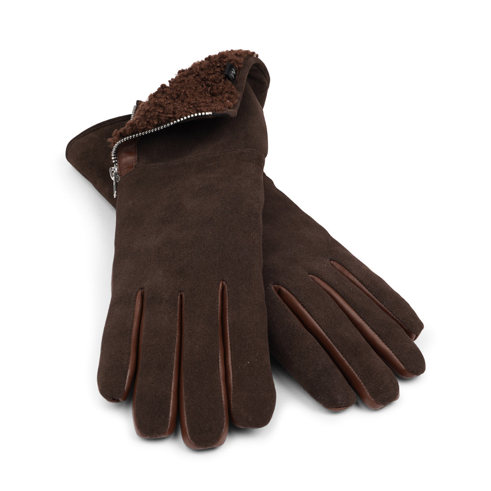 Lovelies Studio - The Cremona gloves combine elegance and warmth, crafted from soft leather with a chic zip detail for a modern touch. Lined with luxurious shearling, these gloves offer superior comfort and insulation.
Their feminine design and refined style make Cremona the perfect accessory for staying stylish in colder weather.