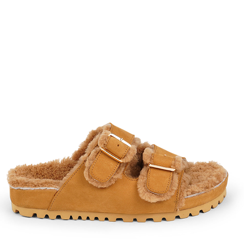 Adjustable nubuck sandals with shearling lining Lovelies shearling sandals will bring softness and warmth to your feet. They are perfect for early spring or autumn or even for a chilly summer night. The combination of soft shearling and the durable cork and rubber sole guarantees the utmost comfort to the wearer.