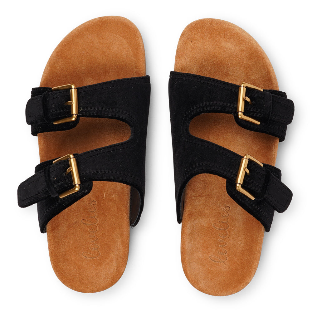 Lovelies Studio - Donori - Velvet double-strap sandals — a perfect blend of laid-back ease and refined luxury. Crafted from plush velvet with a smooth skin lining, they feature two wide straps with adjustable gold-tone buckles for a personalized fit. The contoured footbed, wrapped in premium suede, offers gentle support, while the lightweight sole ensures effortless wear from indoors to out. Ideal for relaxed days, sunny escapes, or stylish lounging at home.Adjustable gold-tone buckles
