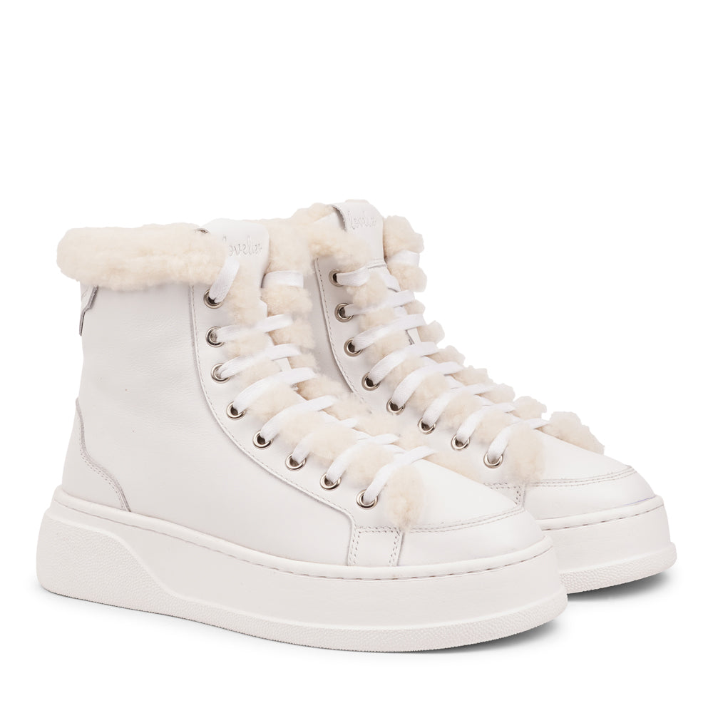 Lovelies Studio - Elevate your sneaker game with the Fajardo High Top, a true embodiment of comfort and style. Crafted to keep you not only fashion-forward but also snug and cozy.
At the foundation of the Fajardo High Top lies a soft yet durable rubber sole, ensuring long-lasting wear and exceptional grip. 
The upper is adorned with leather and features charming shearling details, adding a touch of luxury to your every step. Whether you're dressing up for a night out or aiming for a more casual look.