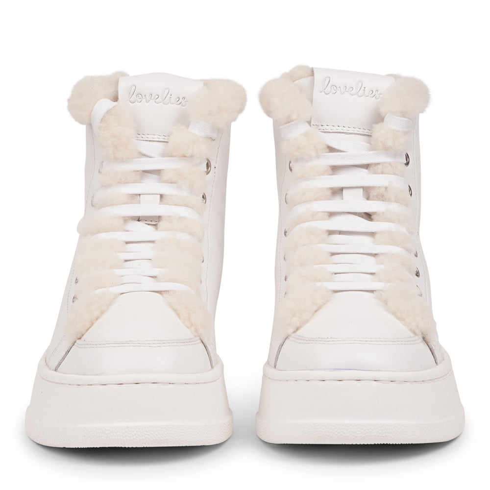Lovelies Studio - Elevate your sneaker game with the Fajardo High Top, a true embodiment of comfort and style. Crafted to keep you not only fashion-forward but also snug and cozy.
At the foundation of the Fajardo High Top lies a soft yet durable rubber sole, ensuring long-lasting wear and exceptional grip. 
The upper is adorned with leather and features charming shearling details, adding a touch of luxury to your every step. Whether you're dressing up for a night out or aiming for a more casual look.