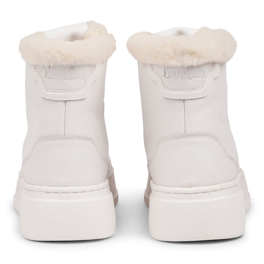 Lovelies Studio - Elevate your sneaker game with the Fajardo High Top, a true embodiment of comfort and style. Crafted to keep you not only fashion-forward but also snug and cozy.
At the foundation of the Fajardo High Top lies a soft yet durable rubber sole, ensuring long-lasting wear and exceptional grip. 
The upper is adorned with leather and features charming shearling details, adding a touch of luxury to your every step. Whether you're dressing up for a night out or aiming for a more casual look.