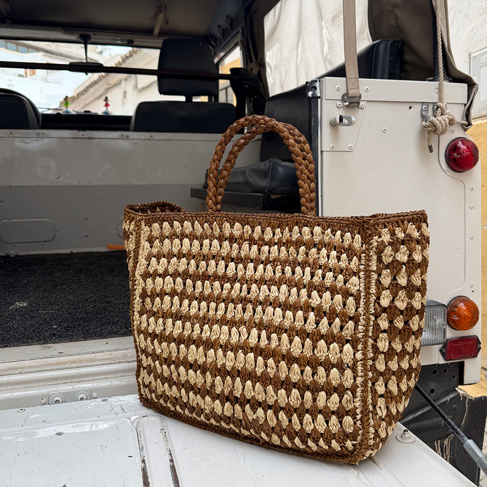 Farella Raffia Bag
Farella is a charming tote crafted from luxurious natural raffia sourced from Madagascar. Lightweight yet spacious, it features a roomy main compartment - perfect for carrying your everyday essentials.
Raffia, made from palm leaves, is known for its durability, natural texture, and eco-friendly qualities. Each bag is carefully handcrafted, combining relaxed elegance with practical design.