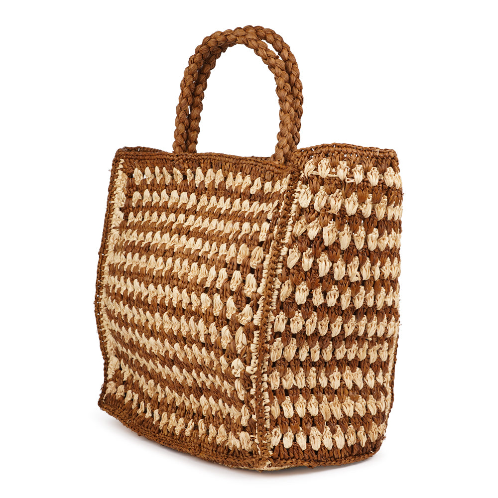 Farella Raffia Bag
Farella is a charming tote crafted from luxurious natural raffia sourced from Madagascar. Lightweight yet spacious, it features a roomy main compartment - perfect for carrying your everyday essentials.
Raffia, made from palm leaves, is known for its durability, natural texture, and eco-friendly qualities. Each bag is carefully handcrafted, combining relaxed elegance with practical design.