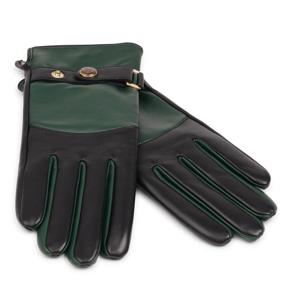 The Ferrara gloves are crafted from supple leather and lined with rich cashmere, offering warmth and lasting comfort. With their feminine silhouette, adjustable cuff strap, and choice of two colors, they blend timeless elegance with everyday practicality.
