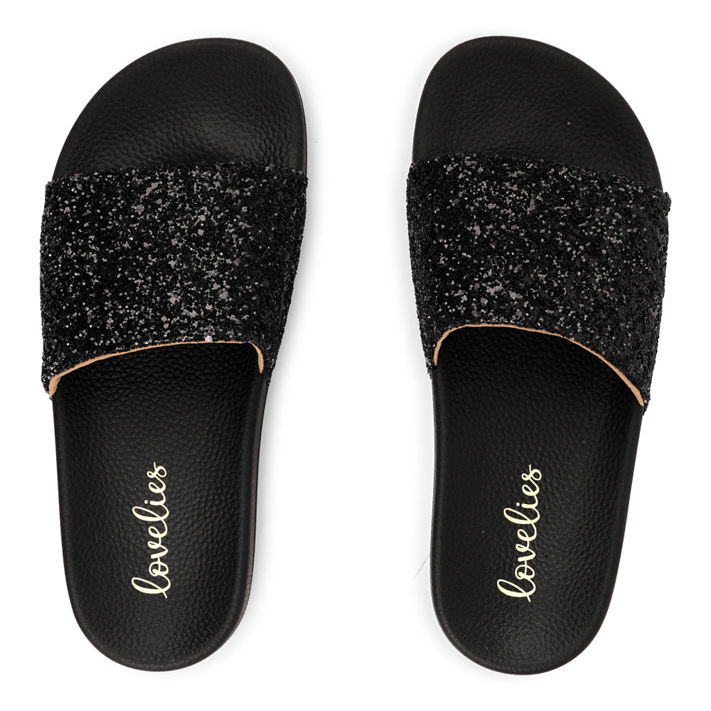 Shine all summer with Fontazzi Glitter Slides!
Perfect for any occasion, these slides feature a full glitter design that adds a touch of sparkle to your look. With a durable yet soft rubber sole, they offer all-day comfort whether you're partying or lounging by the beach.
Step into the spotlight with Fontazzi – the ultimate combination of fun, comfort, and shine!