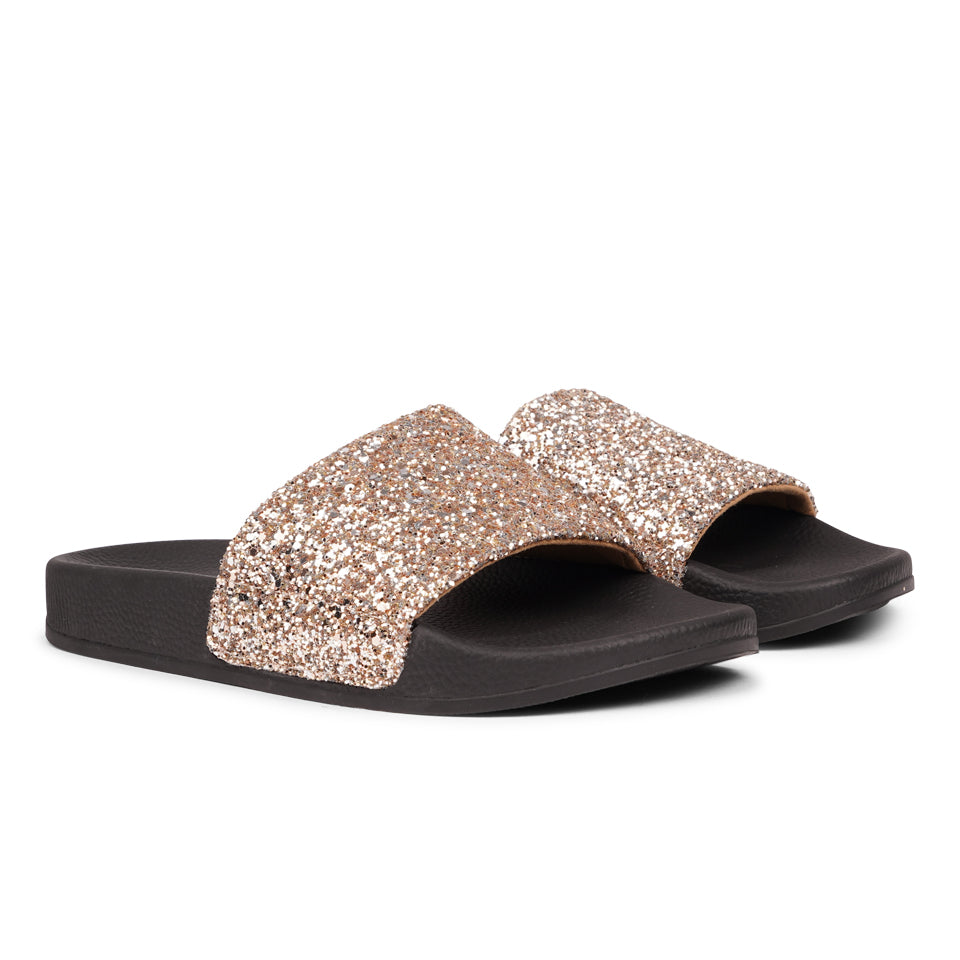 Shine all summer with Fontazzi Glitter Slides!
Perfect for any occasion, these slides feature a full glitter design that adds a touch of sparkle to your look. With a durable yet soft rubber sole, they offer all-day comfort whether you're partying or lounging by the beach.
Step into the spotlight with Fontazzi – the ultimate combination of fun, comfort, and shine!