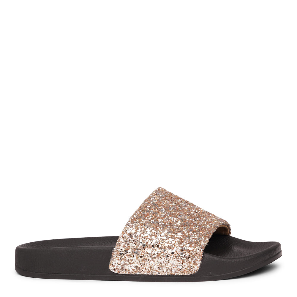 Shine all summer with Fontazzi Glitter Slides!
Perfect for any occasion, these slides feature a full glitter design that adds a touch of sparkle to your look. With a durable yet soft rubber sole, they offer all-day comfort whether you're partying or lounging by the beach.
Step into the spotlight with Fontazzi – the ultimate combination of fun, comfort, and shine!