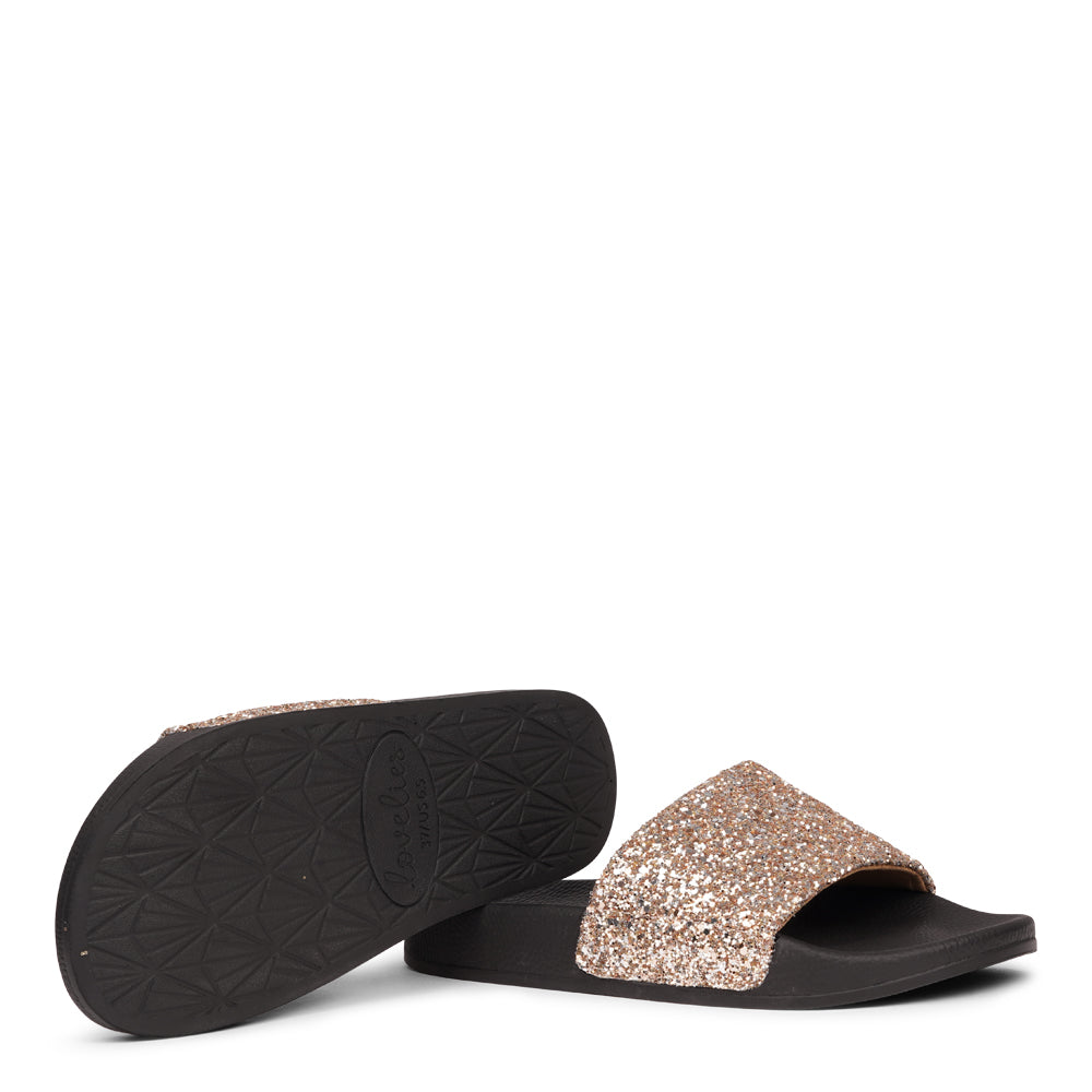 Shine all summer with Fontazzi Glitter Slides!
Perfect for any occasion, these slides feature a full glitter design that adds a touch of sparkle to your look. With a durable yet soft rubber sole, they offer all-day comfort whether you're partying or lounging by the beach.
Step into the spotlight with Fontazzi – the ultimate combination of fun, comfort, and shine!