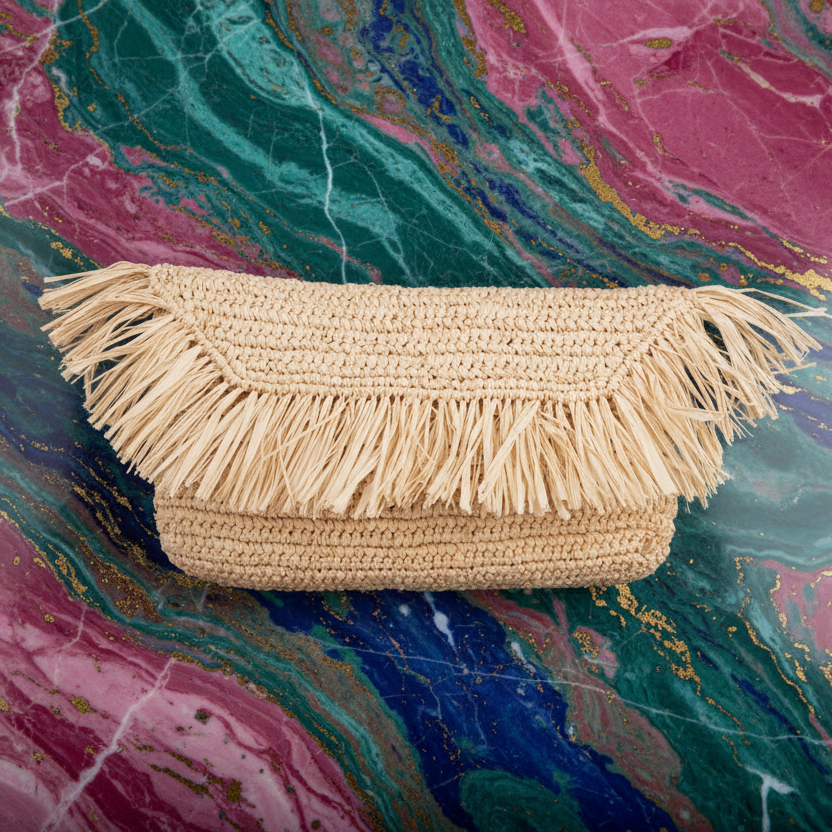 Lovelies - Fresie, the little charming clutch fashioned from luxurious raffia.
Raffia, derived from the resilient leaves of the palm tree, is celebrated for its versatility and eco-conscious qualities, making it a sought-after material in the realm of fashion accessories.
Handcrafted with precision, raffia handbags epitomize a blend of casual sophistication, suitable for a myriad of occasions, be it a leisurely outing or a formal affair.