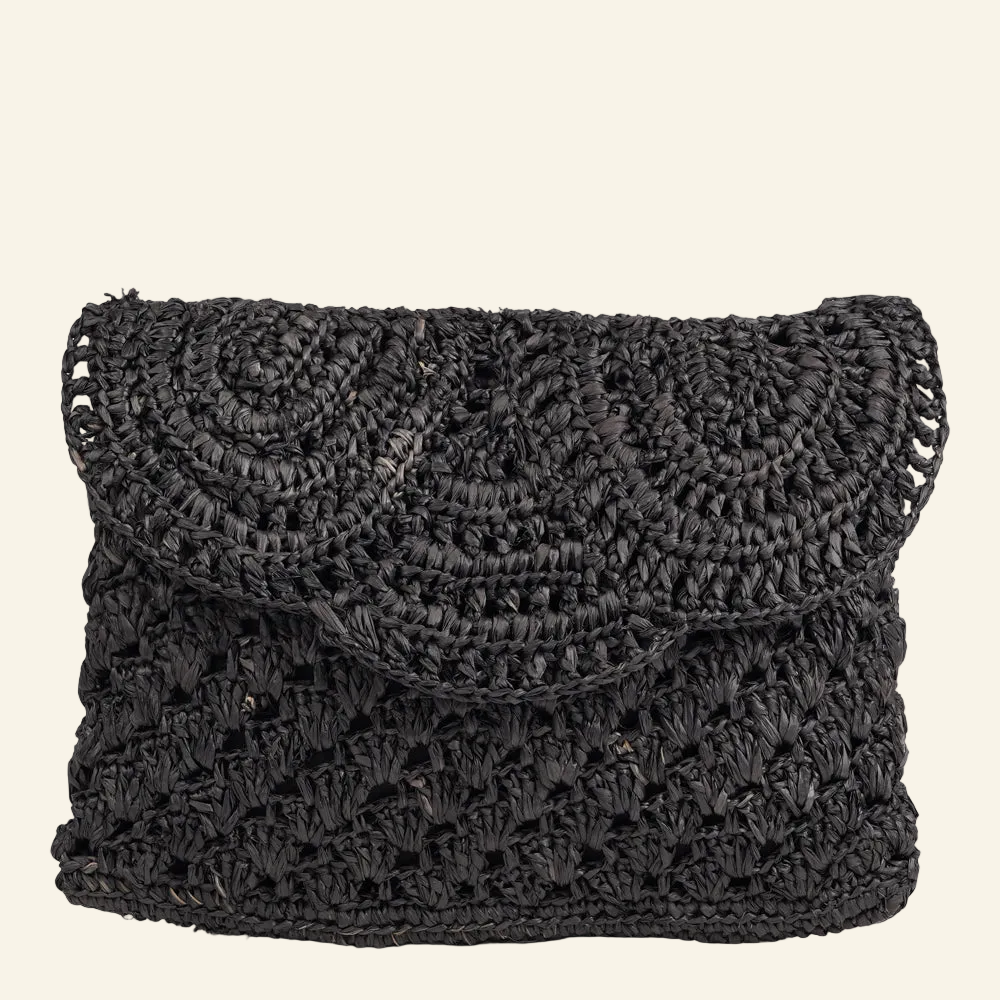 Lovelies - Gerani, the little charming clutch fashioned from luxurious raffia.
Raffia comes from the leaves of palm trees and is loved for being both versatile and more eco-friendly, making it a popular choice for accessories.
Handwoven raffia bags combine a relaxed look with a touch of elegance, making them easy to style for both everyday wear and more dressed-up occasions. The natural texture and soft tones add a simple, refined feel to any outfit.