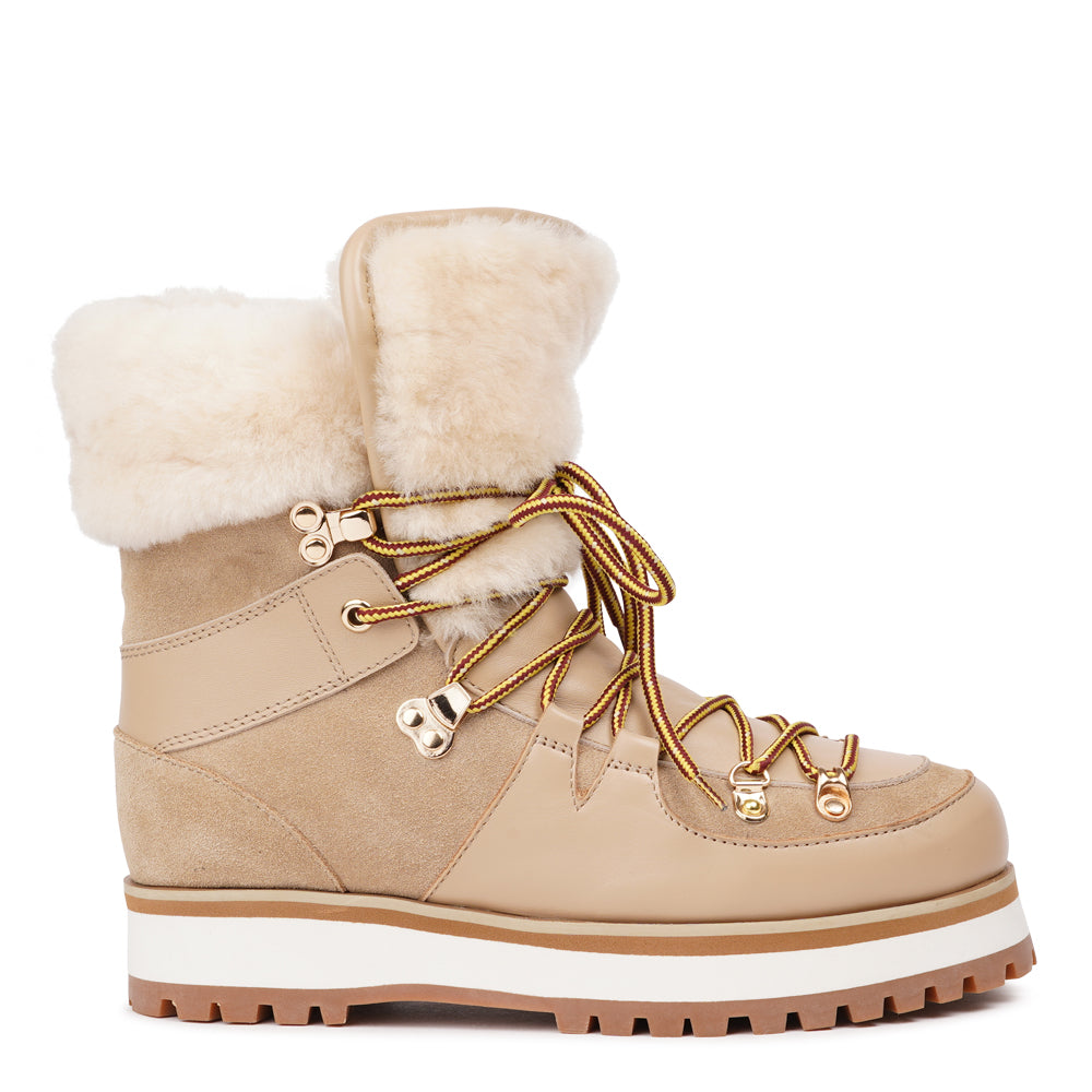Meet the Mount Q, a trekking boot that defines luxury and performance. These boots are a testament to the finest craftsmanship, using high-end leather that's not only elegant but incredibly durable.
The addition of shearling details not only adds a touch of beauty but also keeps your feet warm and cozy during winter adventures. What's more, the robust rubber soles provide unmatched traction, making these boots perfect for icy winters. Elevate your outdoor experiences with the Mount Q, where style mee