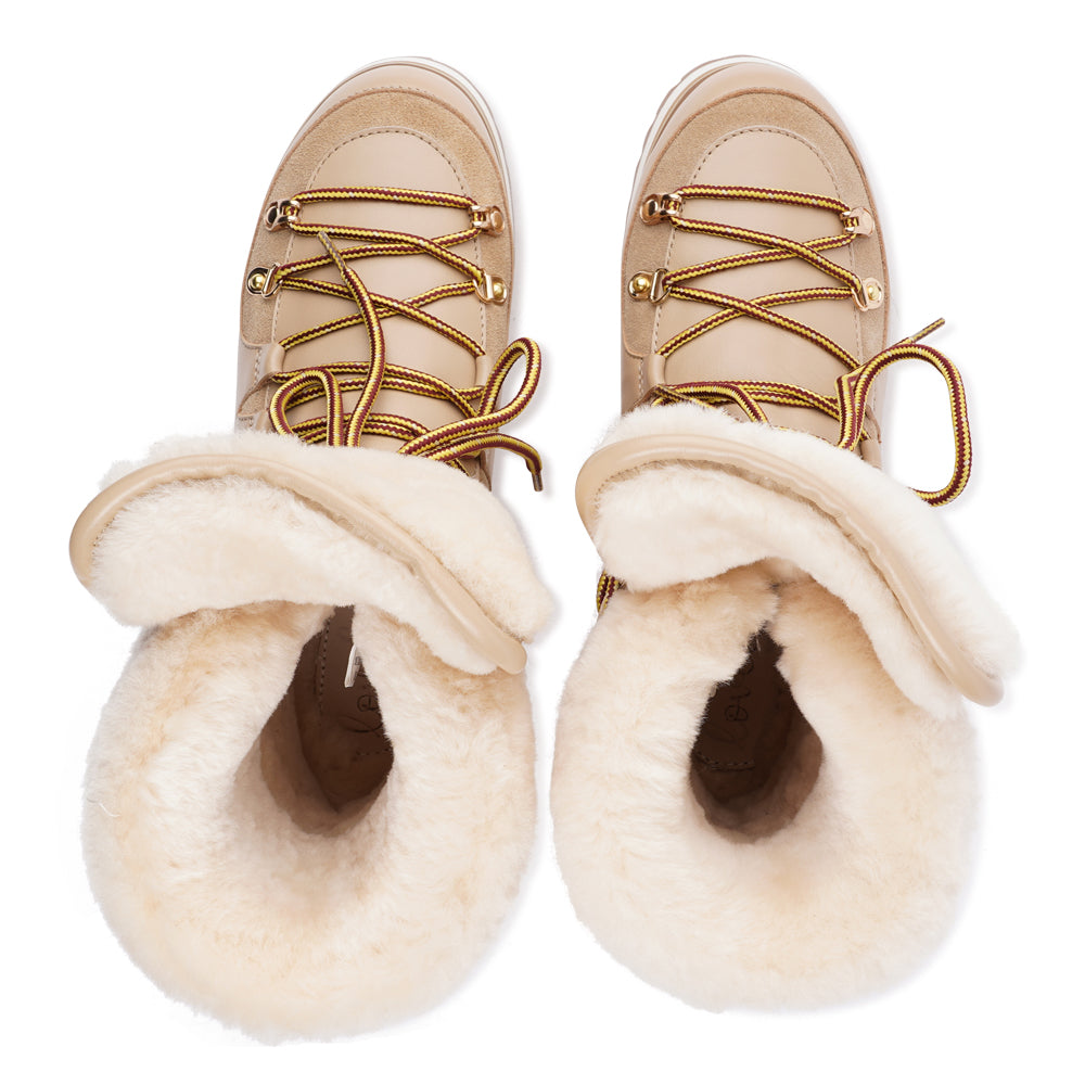 Meet the Mount Q, a trekking boot that defines luxury and performance. These boots are a testament to the finest craftsmanship, using high-end leather that's not only elegant but incredibly durable.
The addition of shearling details not only adds a touch of beauty but also keeps your feet warm and cozy during winter adventures. What's more, the robust rubber soles provide unmatched traction, making these boots perfect for icy winters. Elevate your outdoor experiences with the Mount Q, where style mee