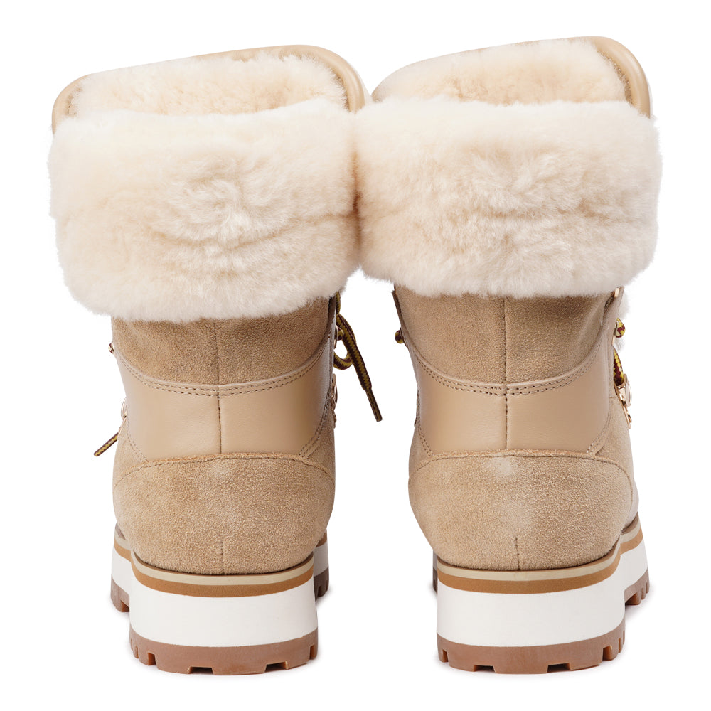 Meet the Mount Q, a trekking boot that defines luxury and performance. These boots are a testament to the finest craftsmanship, using high-end leather that's not only elegant but incredibly durable.
The addition of shearling details not only adds a touch of beauty but also keeps your feet warm and cozy during winter adventures. What's more, the robust rubber soles provide unmatched traction, making these boots perfect for icy winters. Elevate your outdoor experiences with the Mount Q, where style mee