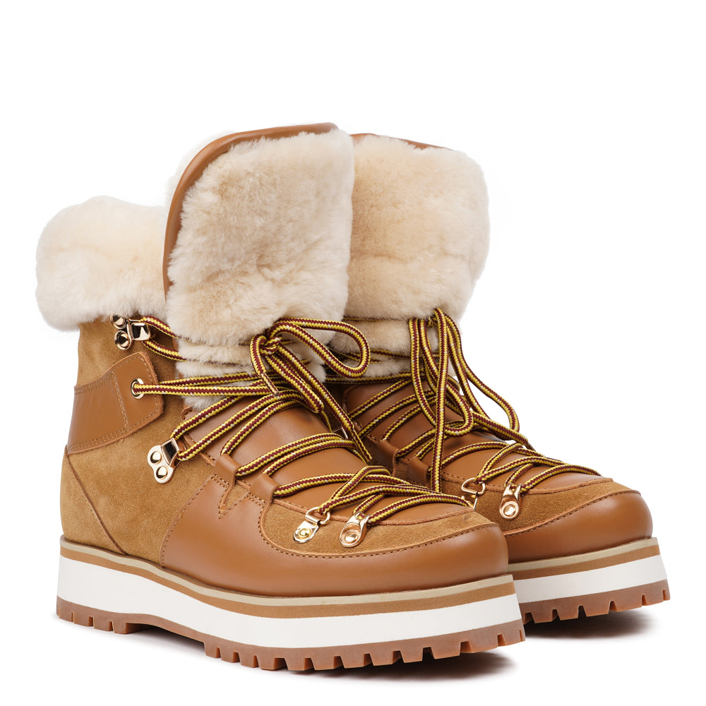 Meet the Mount Q, a trekking boot that defines luxury and performance. These boots are a testament to the finest craftsmanship, using high-end leather that's not only elegant but incredibly durable.
The addition of shearling details not only adds a touch of beauty but also keeps your feet warm and cozy during winter adventures. What's more, the robust rubber soles provide unmatched traction, making these boots perfect for icy winters. Elevate your outdoor experiences with the Mount Q, where style mee