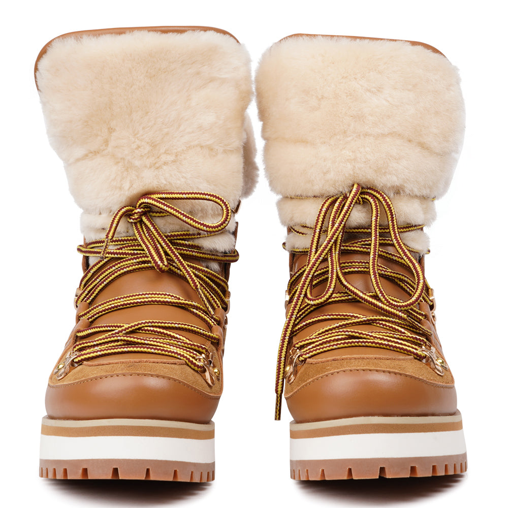Meet the Mount Q, a trekking boot that defines luxury and performance. These boots are a testament to the finest craftsmanship, using high-end leather that's not only elegant but incredibly durable.
The addition of shearling details not only adds a touch of beauty but also keeps your feet warm and cozy during winter adventures. What's more, the robust rubber soles provide unmatched traction, making these boots perfect for icy winters. Elevate your outdoor experiences with the Mount Q, where style mee