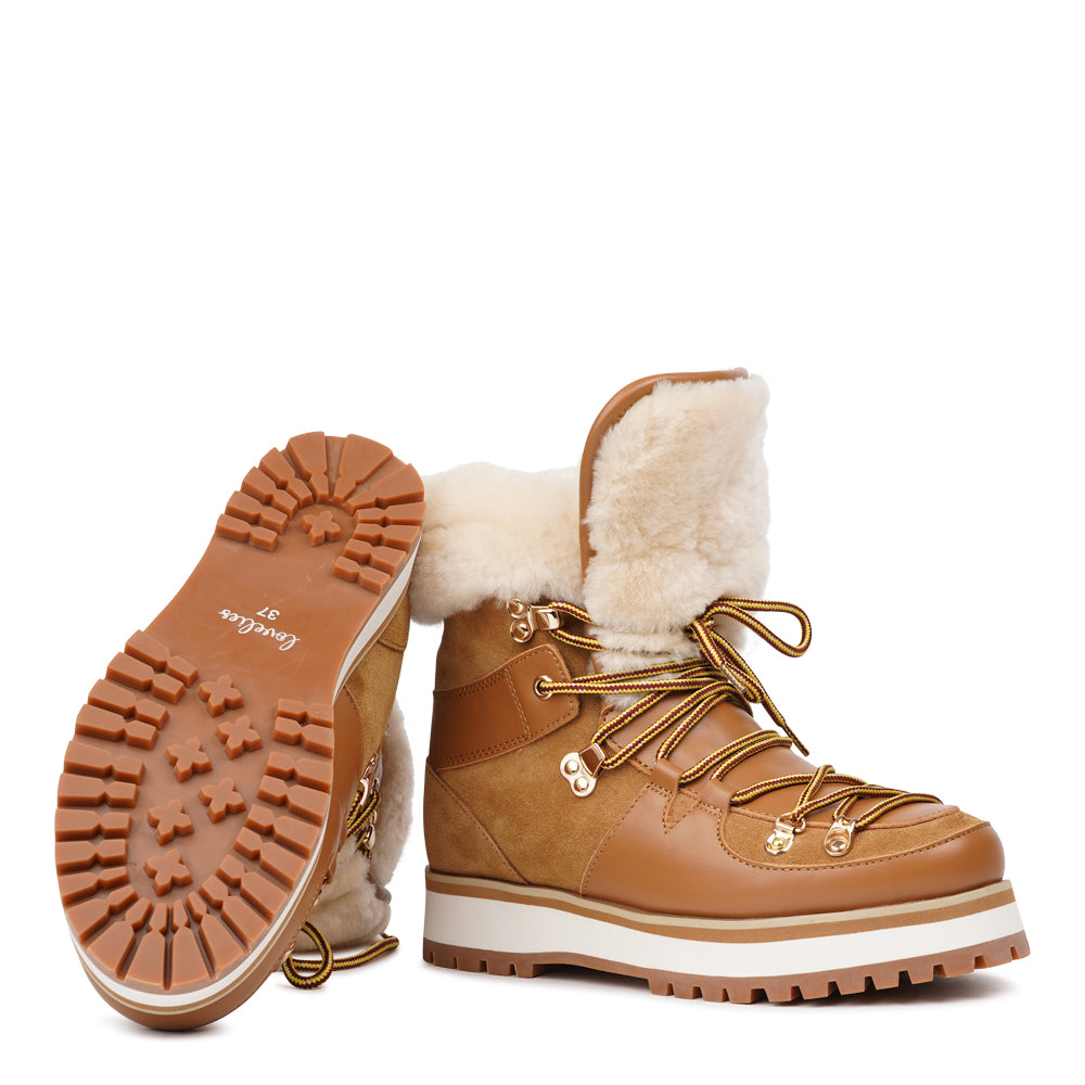 Meet the Mount Q, a trekking boot that defines luxury and performance. These boots are a testament to the finest craftsmanship, using high-end leather that's not only elegant but incredibly durable.
The addition of shearling details not only adds a touch of beauty but also keeps your feet warm and cozy during winter adventures. What's more, the robust rubber soles provide unmatched traction, making these boots perfect for icy winters. Elevate your outdoor experiences with the Mount Q, where style mee