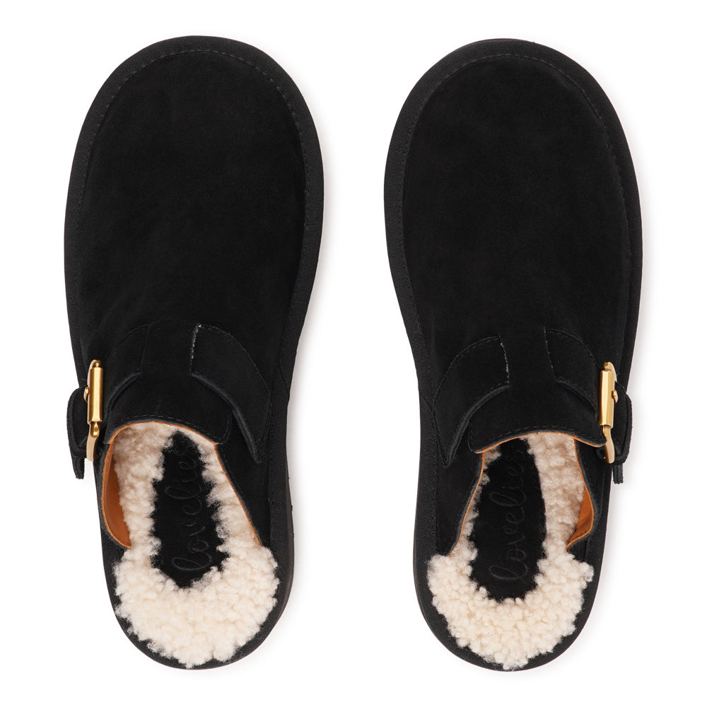 Lovelies Studio - Kokubo – Suede Mules with Adjustable Buckle
Meet Kokubo — a pair of mules that redefine everyday comfort with understated elegance. What makes them special is the plush shearling insole that gently cushions your feet, offering natural warmth and luxurious softness, even on a cold days.
Crafted from premium suede and finished with a durable rubber sole, the Kokubo mules combine style, comfort, and longevity in one effortless design.