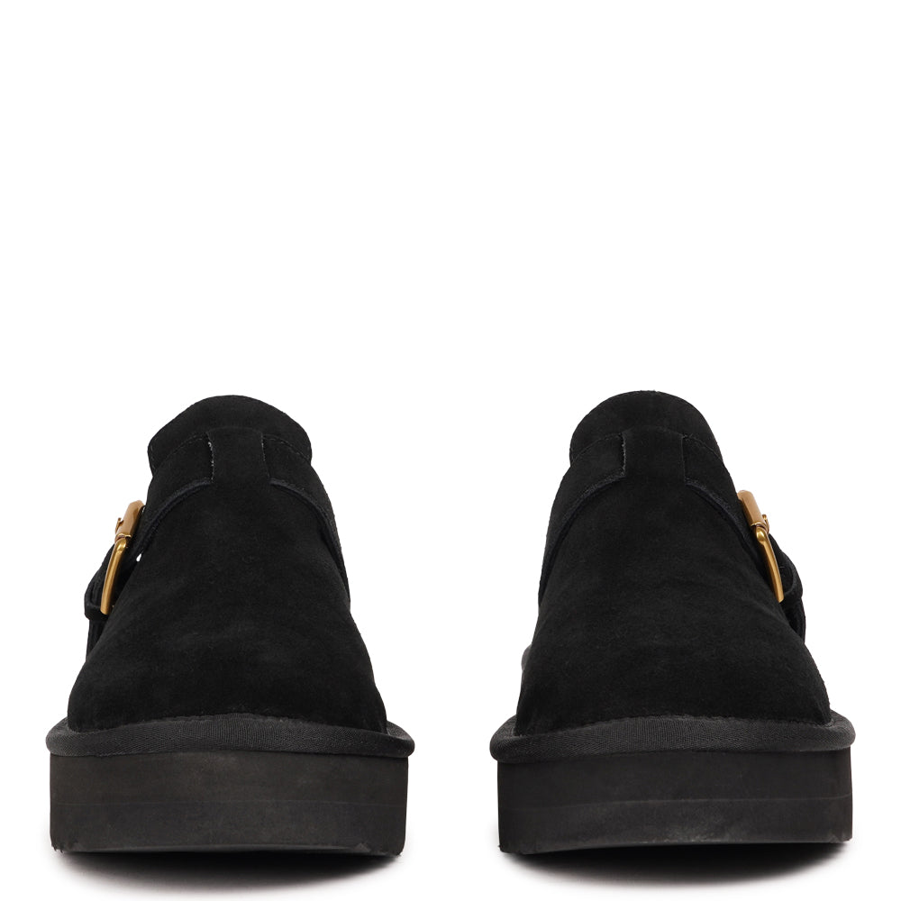 Lovelies Studio - Kokubo – Suede Mules with Adjustable Buckle
Meet Kokubo — a pair of mules that redefine everyday comfort with understated elegance. What makes them special is the plush shearling insole that gently cushions your feet, offering natural warmth and luxurious softness, even on a cold days.
Crafted from premium suede and finished with a durable rubber sole, the Kokubo mules combine style, comfort, and longevity in one effortless design.