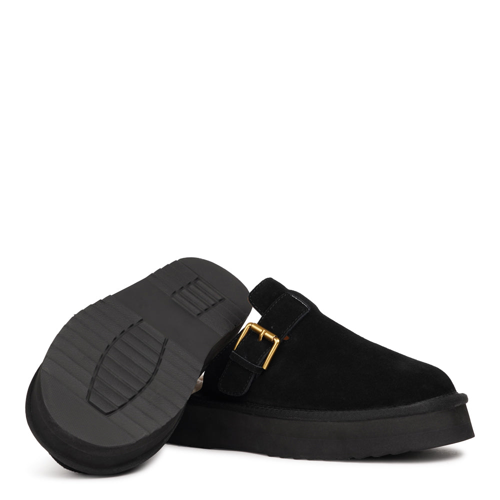 Lovelies Studio - Kokubo – Suede Mules with Adjustable Buckle
Meet Kokubo — a pair of mules that redefine everyday comfort with understated elegance. What makes them special is the plush shearling insole that gently cushions your feet, offering natural warmth and luxurious softness, even on a cold days.
Crafted from premium suede and finished with a durable rubber sole, the Kokubo mules combine style, comfort, and longevity in one effortless design.