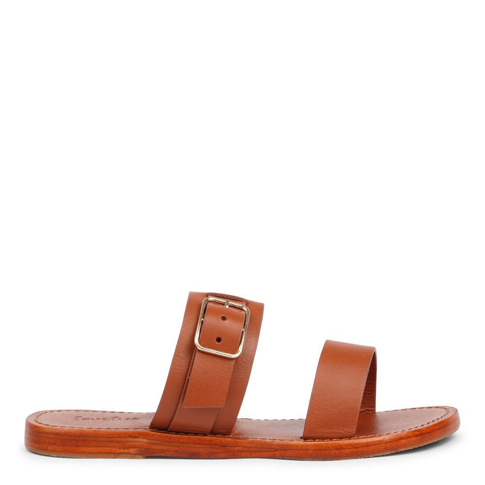 Lacco is our beautifully handcrafted leather sandal, designed to bring feminine elegance and all-day ease to your wardrobe. Featuring a single adjustable buckle for a secure, personalized fit, Lacco strikes the perfect balance between style and functionality.
Made from vegetable-tanned buffalo leather, the soft yet sturdy straps offer lasting comfort. The leather sole with a rubber grip provides reliable traction, whether you're dressing up or keeping it casual.