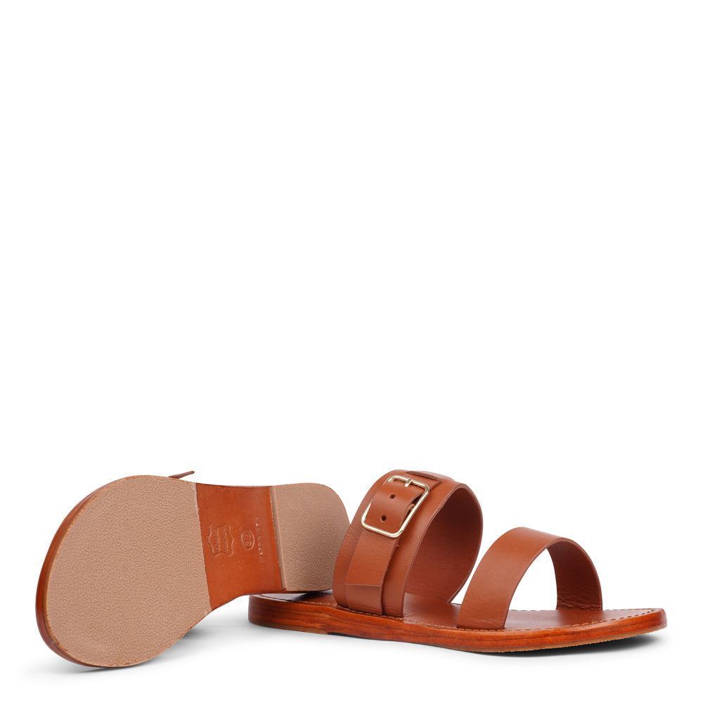 Lacco is our beautifully handcrafted leather sandal, designed to bring feminine elegance and all-day ease to your wardrobe. Featuring a single adjustable buckle for a secure, personalized fit, Lacco strikes the perfect balance between style and functionality.
Made from vegetable-tanned buffalo leather, the soft yet sturdy straps offer lasting comfort. The leather sole with a rubber grip provides reliable traction, whether you're dressing up or keeping it casual.