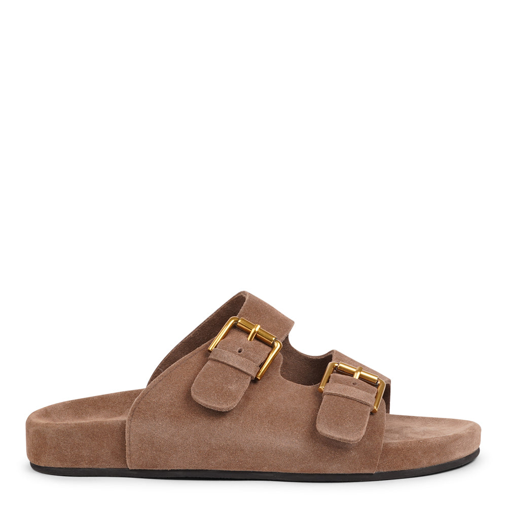 Lovelies Studio - Effortlessly laid-back with a touch of understated luxury, these suede sandals are designed for all-day comfort and timeless appeal. Crafted from rich, soft suede, they feature two wide straps with adjustable gold-tone buckles for a customizable fit. The contoured footbed offers light support, while the flexible sole ensures ease of movement from indoors to out.
Perfect for casual days, warm getaways, or everyday lounging in style.
Adjustable straps with metal buckles
Soft, cushioned foot