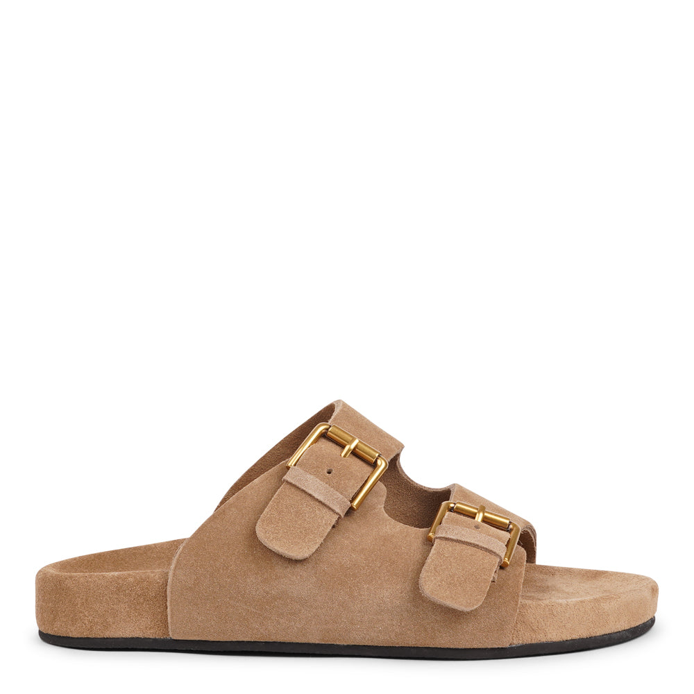 Lovelies Studio - Denmark - Effortlessly laid-back with a touch of understated luxury, these suede sandals are designed for all-day comfort and timeless appeal. Crafted from rich, soft suede, they feature two wide straps with adjustable gold-tone buckles for a customizable fit. The contoured footbed offers light support, while the flexible sole ensures ease of movement from indoors to out.
Perfect for casual days, warm getaways, or everyday lounging in style.