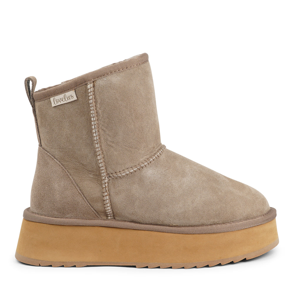 Designed for your ultimate comfort, these luxurious shearling boots are the perfect winter companions. Featuring soft, durable rubber soles, they ensure you can step through the colder months with confidence, keeping your feet well-protected from the elements.
Lovelies Studio - But Laveno offers more than just practicality—these boots blend warmth and style seamlessly, making them as fashionable as they are functional.