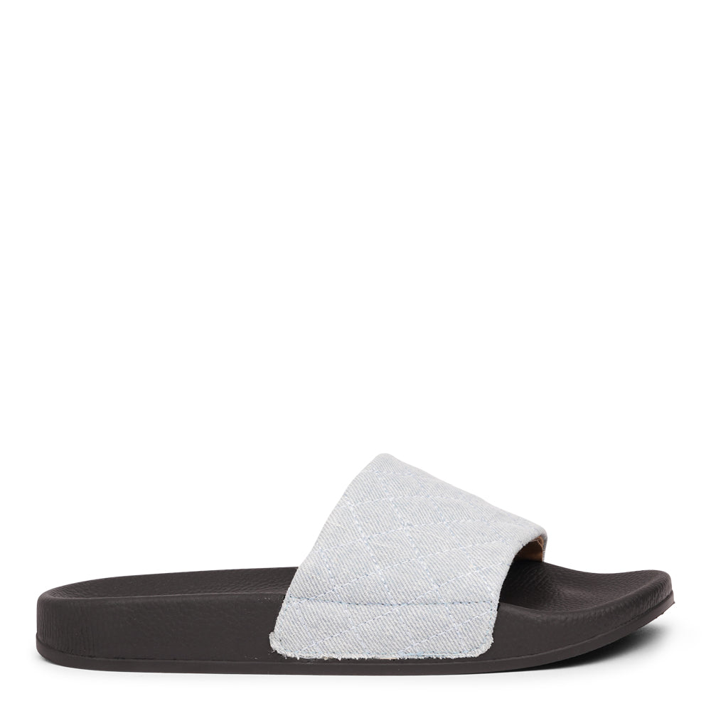 Crafted from quilted denim and featuring a butter-soft outsole, these slides are light, breezy, and effortlessly chic. Perfect for everyday wear, they bring comfort and style to any summer look.
Slip in and step out in style!