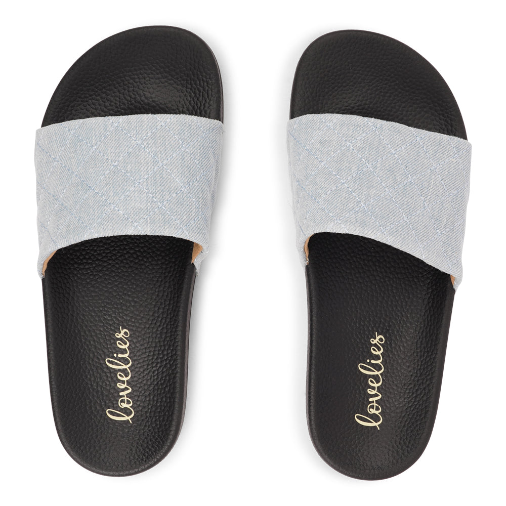 Crafted from quilted denim and featuring a butter-soft outsole, these slides are light, breezy, and effortlessly chic. Perfect for everyday wear, they bring comfort and style to any summer look.
Slip in and step out in style!