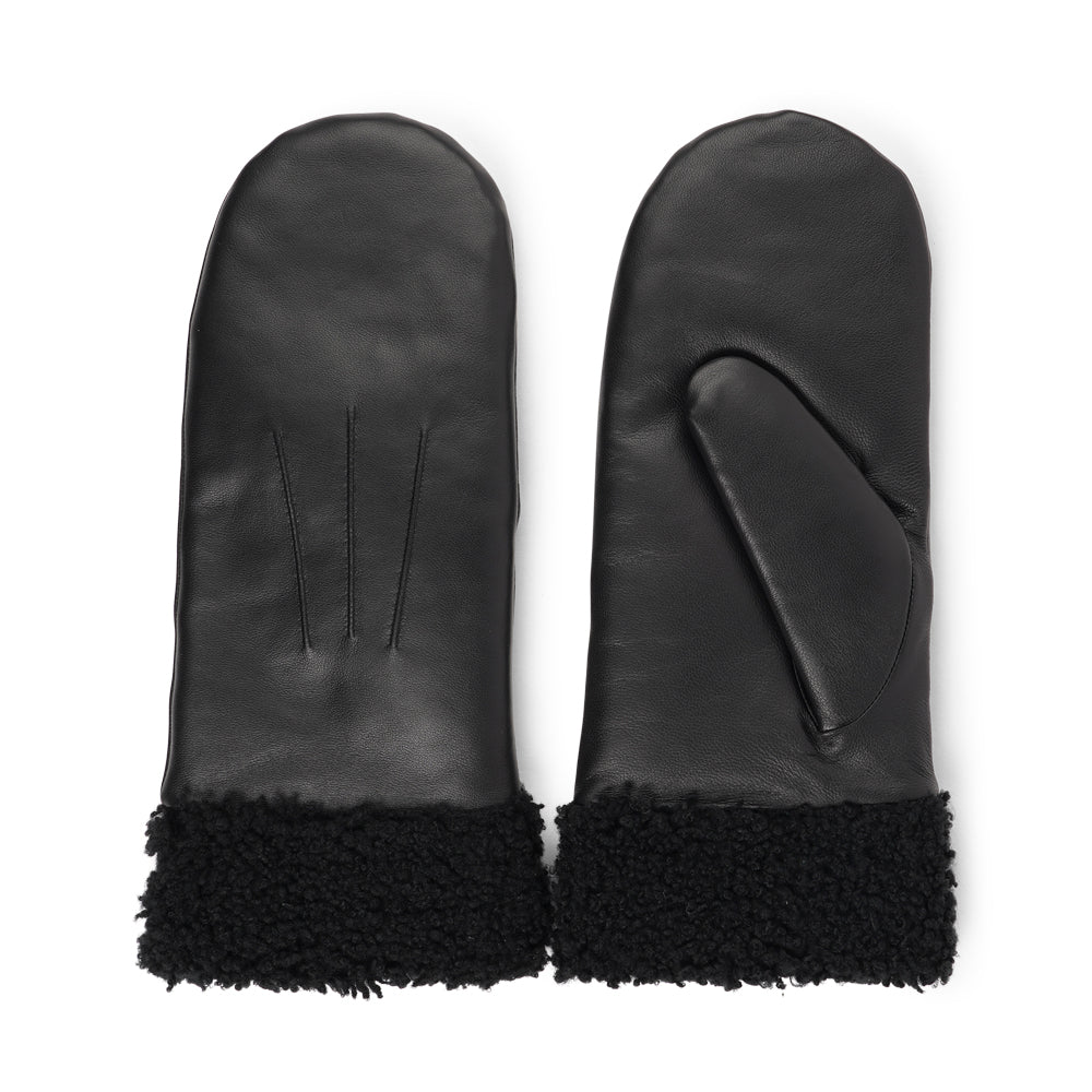 The Matera mittens are a perfect blend of elegance and warmth, crafted from premium leather and lined with soft, curly shearling.
Their feminine design offers both style and comfort, making them an ideal choice for chilly days. With a luxurious feel and timeless look, these mittens are a chic winter essential.
