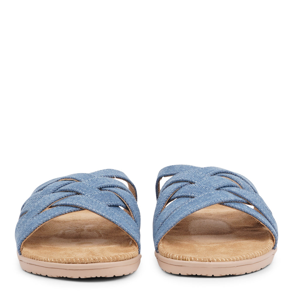 Say hello to the captivating Matara sandal, drawing inspiration from the stunning coasts of Sri Lanka. This sandal is a luxurious treat, featuring durable rubber embraced by velvety suede. With delicate denim straps adding a playful flair, it effortlessly enhances any ensemble. It's the ultimate blend of chic and trendy style.