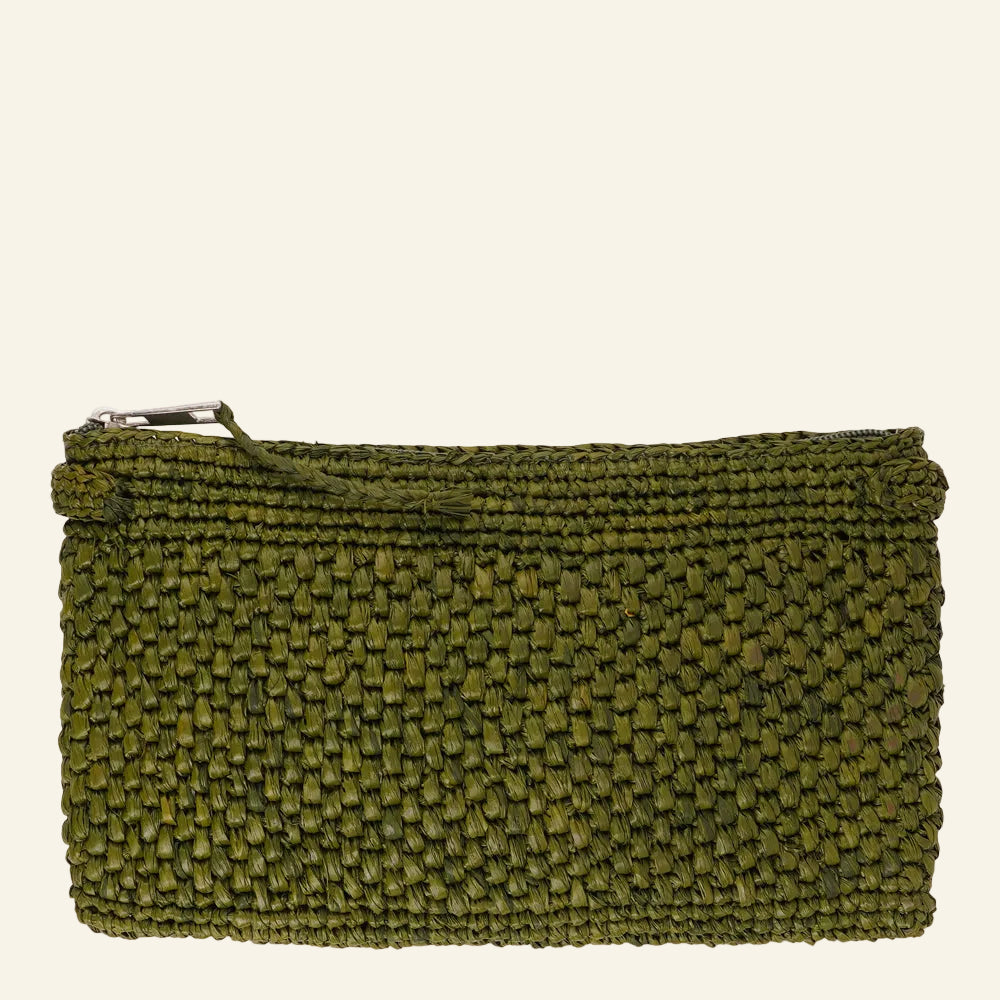 Meliso, the little charming clutch fashioned from luxurious raffia sourced from Madagascar.
Raffia, derived from the resilient leaves of the palm tree, is celebrated for its versatility and eco-conscious qualities, making it a sought-after material in the realm of fashion accessories.