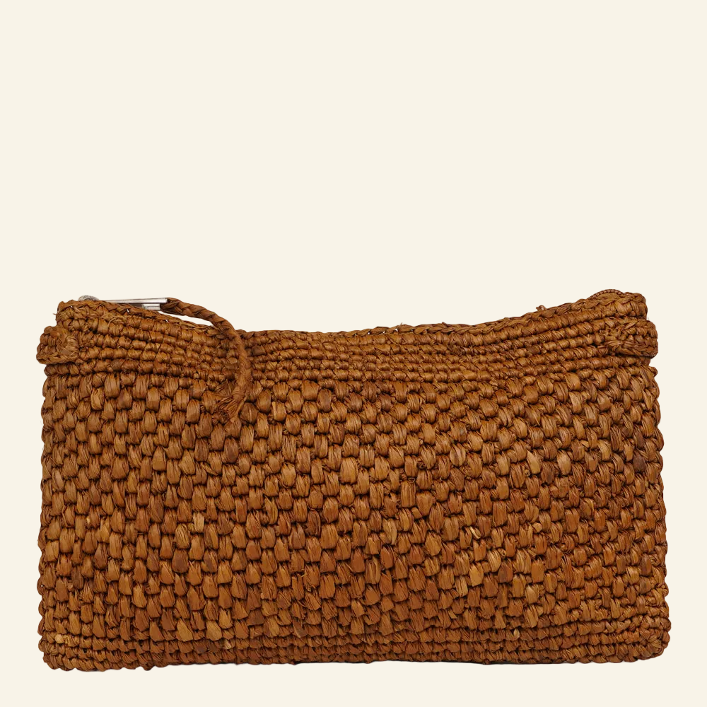 Lovelies - Meliso, the little charming clutch fashioned from luxurious raffia sourced from Madagascar.
Raffia, derived from the resilient leaves of the palm tree, is celebrated for its versatility and eco-conscious qualities, making it a sought-after material in the realm of fashion accessories.
Handcrafted with precision, raffia handbags epitomize a blend of casual sophistication, suitable for a myriad of occasions, be it a leisurely outing or a formal affair.