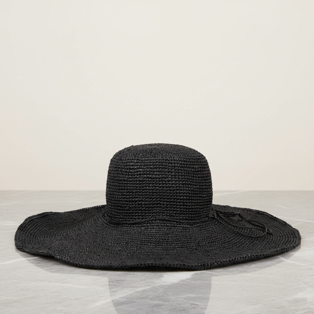The Monti beach hat is a gorgeous piece, painstakingly crafted by talented local artisans in Madagascar, exclusively for Lovelies Studio. Each hat is a testament to the craftsmanship and devotion of these artisans, who meticulously handcraft every element with precision and care.
Crafted from raffia, a natural fiber celebrated for its strength and suppleness, the Monti hat embodies both style and sustainability. Utilizing traditional methods, the raffia is hand-dyed and left to bask in the sun,