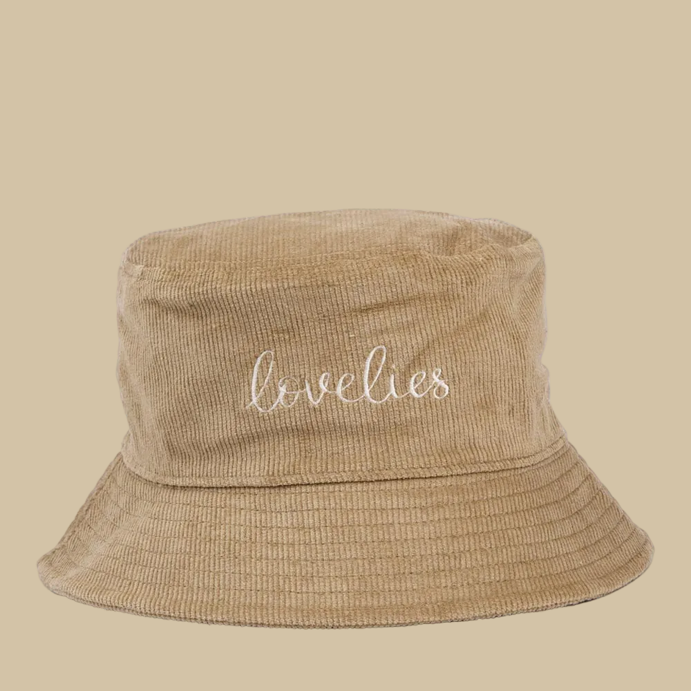 MUCCIA — Corduroy Bucket Hat w/ Embroidery
Meet your new favorite hat. The Muccia Bucket Hat combines the soft, textured feel of corduroy with the signature Lovelies embroidered logo for a look that's laid-back yet effortlessly stylish.
Perfect for sunny days, casual outings, or whenever you want to add a little character to your outfit.