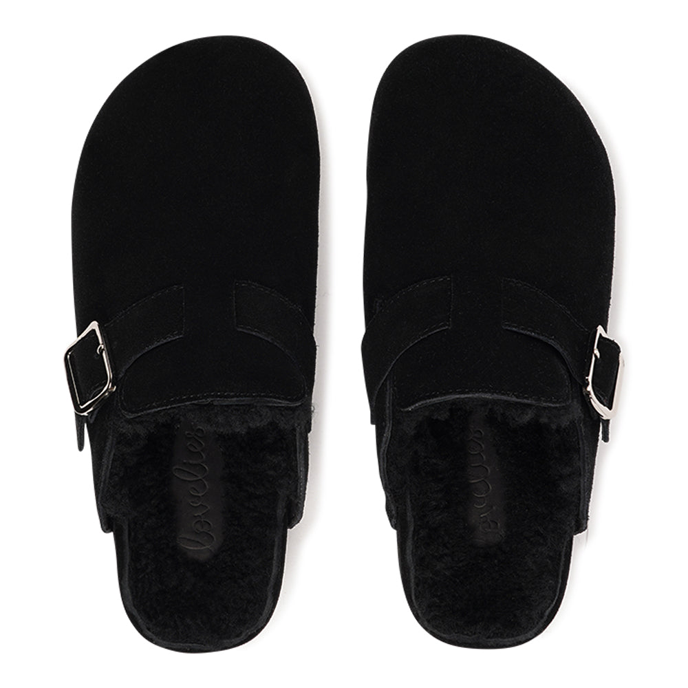 The Nesso Suede Mules are the epitome of luxurious comfort and style. Crafted with a premium suede upper, these exclusive mules feature an adjustable buckle for a customized fit. Lined with soft curly shearling, they provide warmth and a cozy feel, perfect for cooler days. 
The durable rubber sole ensures long-lasting wear and excellent traction, making them a practical yet indulgent choice. With their elegant design and plush materials, the Nesso Suede Mules effortlessly blend functionality with fash
