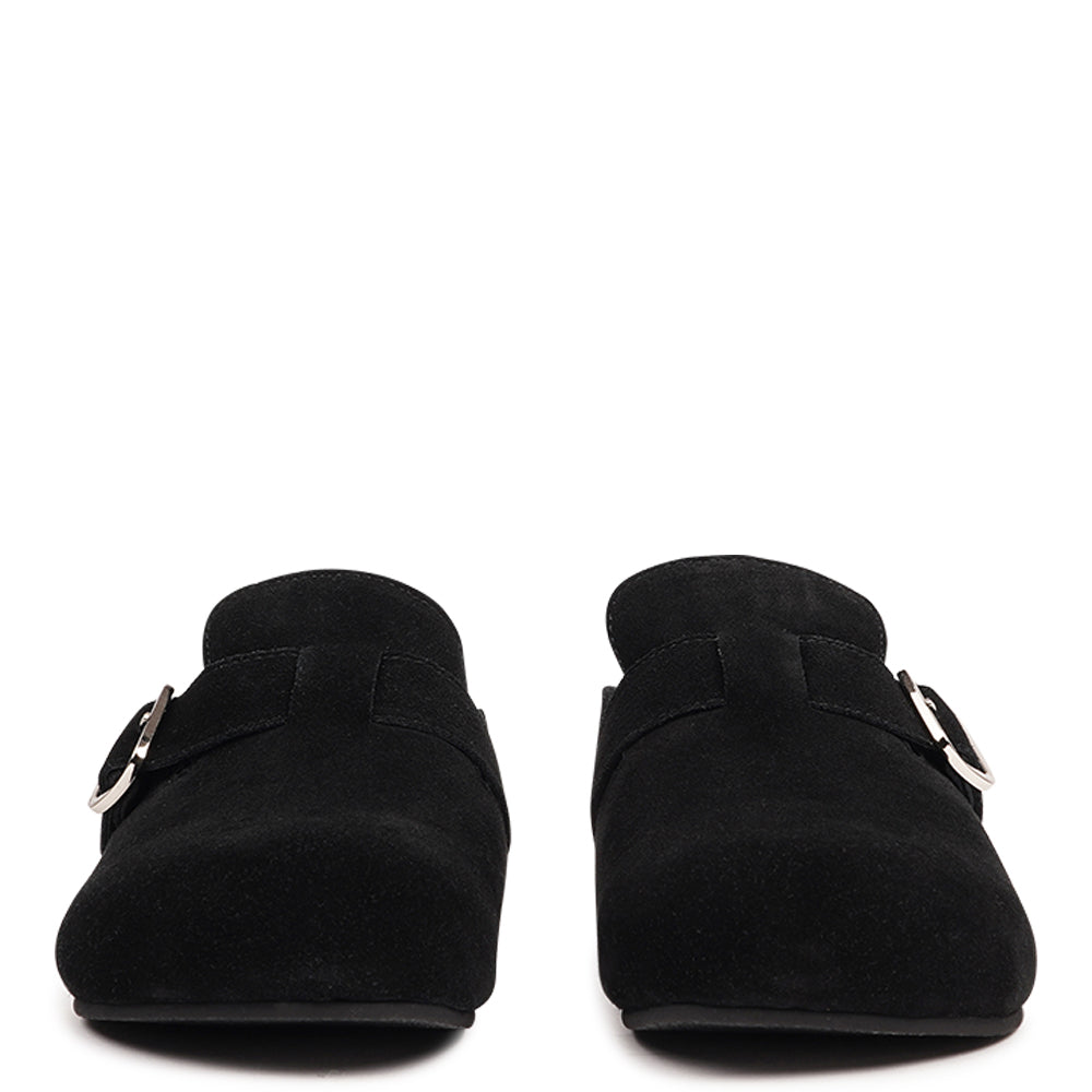 The Nesso Suede Mules are the epitome of luxurious comfort and style. Crafted with a premium suede upper, these exclusive mules feature an adjustable buckle for a customized fit. Lined with soft curly shearling, they provide warmth and a cozy feel, perfect for cooler days.
The durable rubber sole ensures long-lasting wear and excellent traction, making them a practical yet indulgent choice. With their elegant design and plush materials, the Nesso Suede Mules effortlessly blend functionality with fash