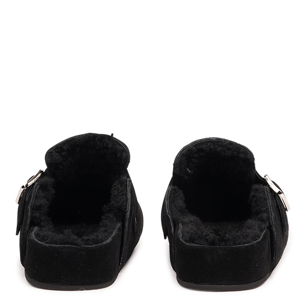 The Nesso Suede Mules are the epitome of luxurious comfort and style. Crafted with a premium suede upper, these exclusive mules feature an adjustable buckle for a customized fit. Lined with soft curly shearling, they provide warmth and a cozy feel, perfect for cooler days.
The durable rubber sole ensures long-lasting wear and excellent traction, making them a practical yet indulgent choice. With their elegant design and plush materials, the Nesso Suede Mules effortlessly blend functionality with fash